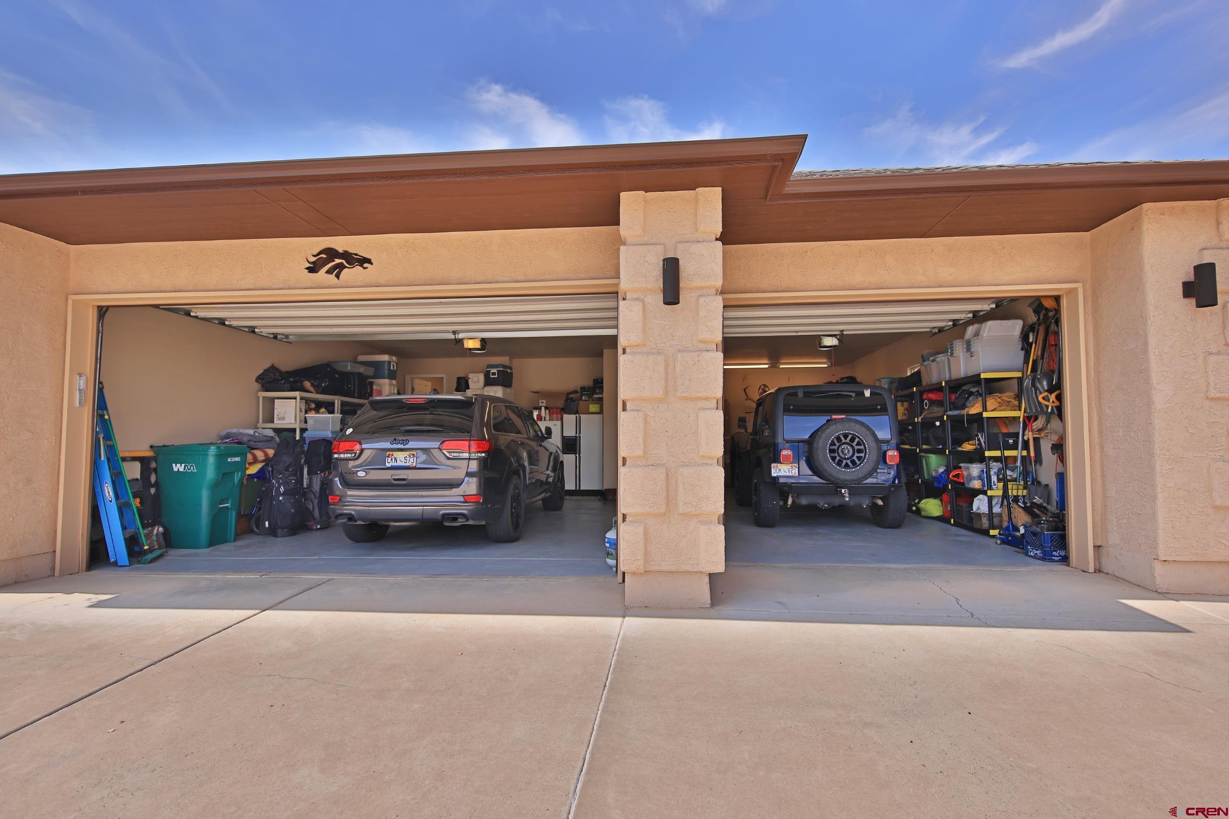 339 Canyon Rim Court Grand Junction, CO 81507 - Photo 35 of 40 a view of a garage with cars
