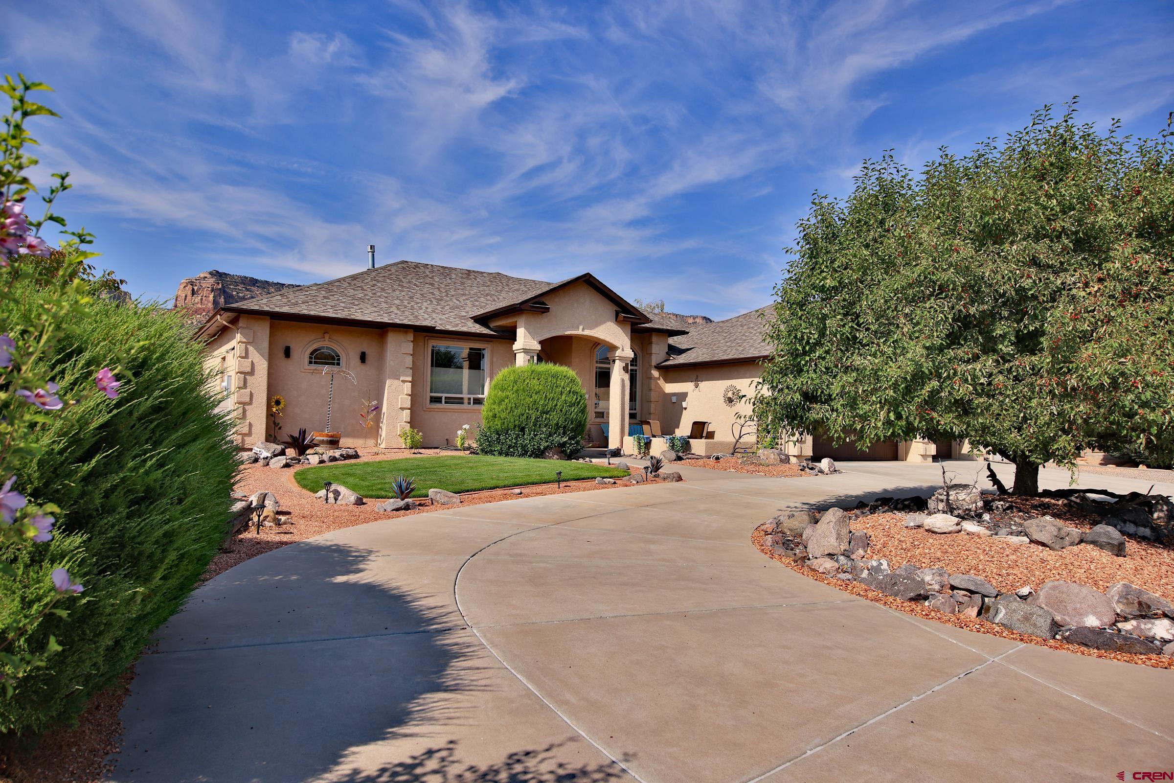 339 Canyon Rim Court Grand Junction, CO 81507 - Photo 39 of 40 a view of a house with a patio