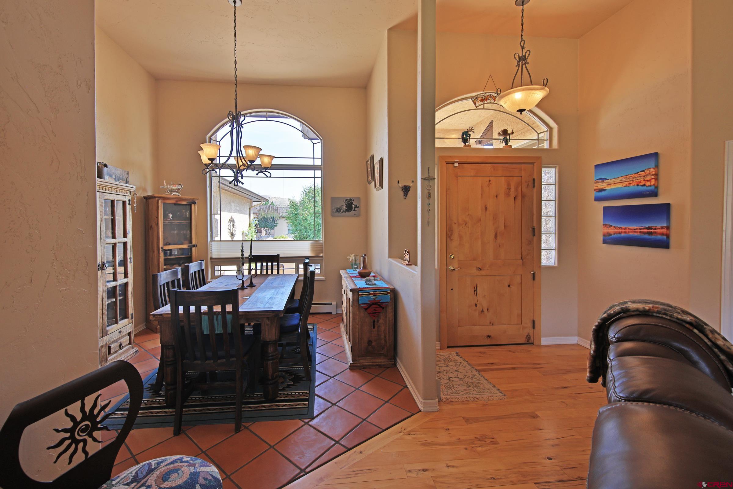339 Canyon Rim Court Grand Junction, CO 81507 - Photo 8 of 40 a view of a dining room with furniture window and outside view