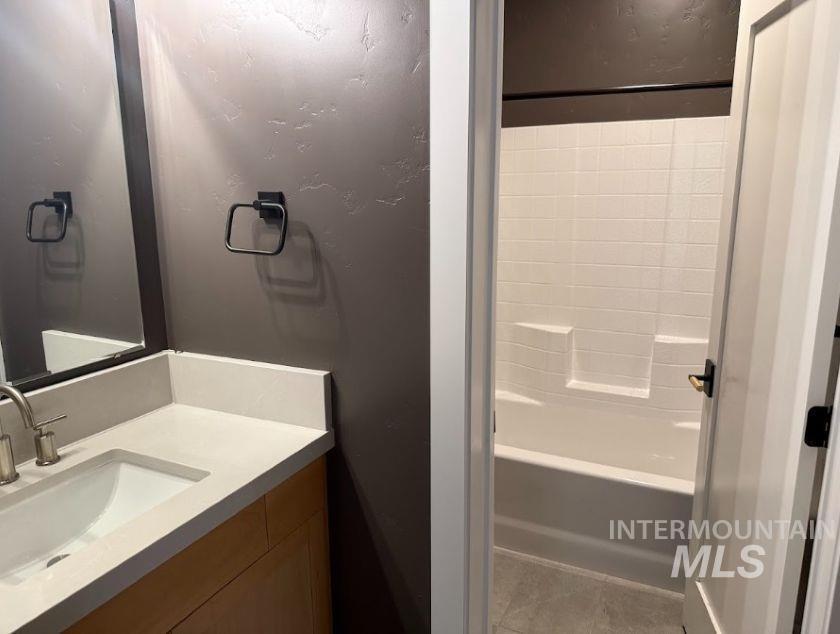 755 West Wrangler Street Meridian, ID 83646 - Photo 17 of 35 Bathroom featuring a vanity with an integrated sink and light-colored countertop