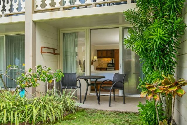 a view of a chairs and table in a porch