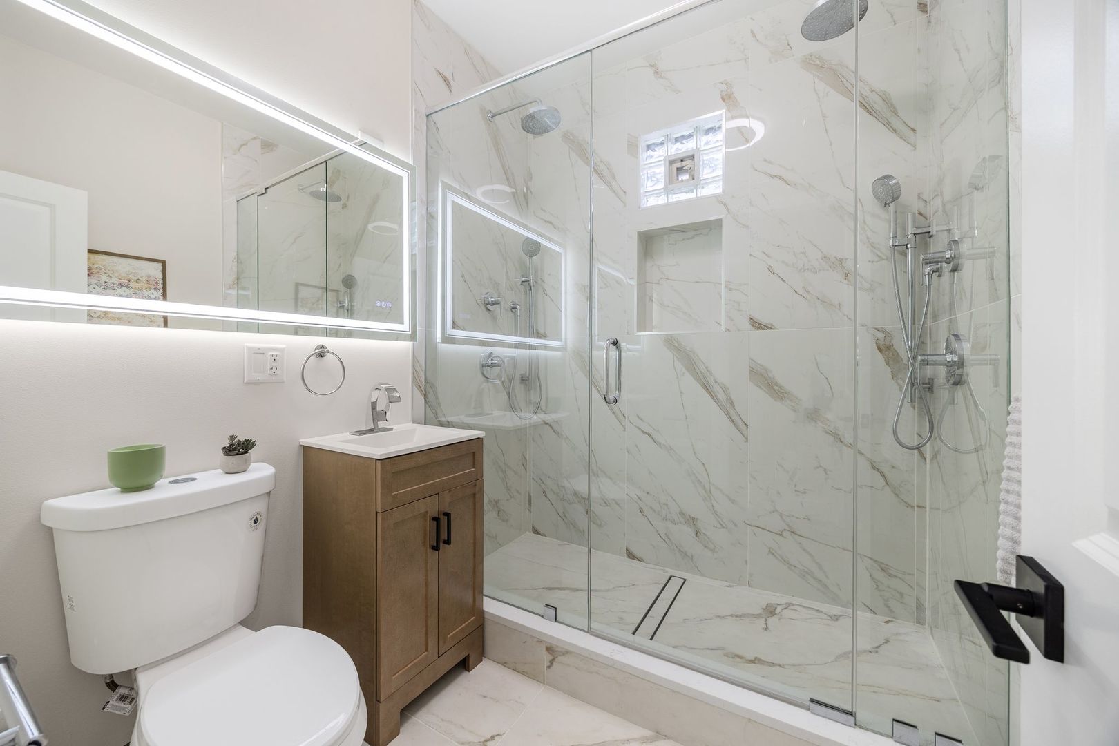 4143 North Drake Avenue Chicago, IL 60618 - Photo 16 of 40 a bathroom with a sink toilet and shower