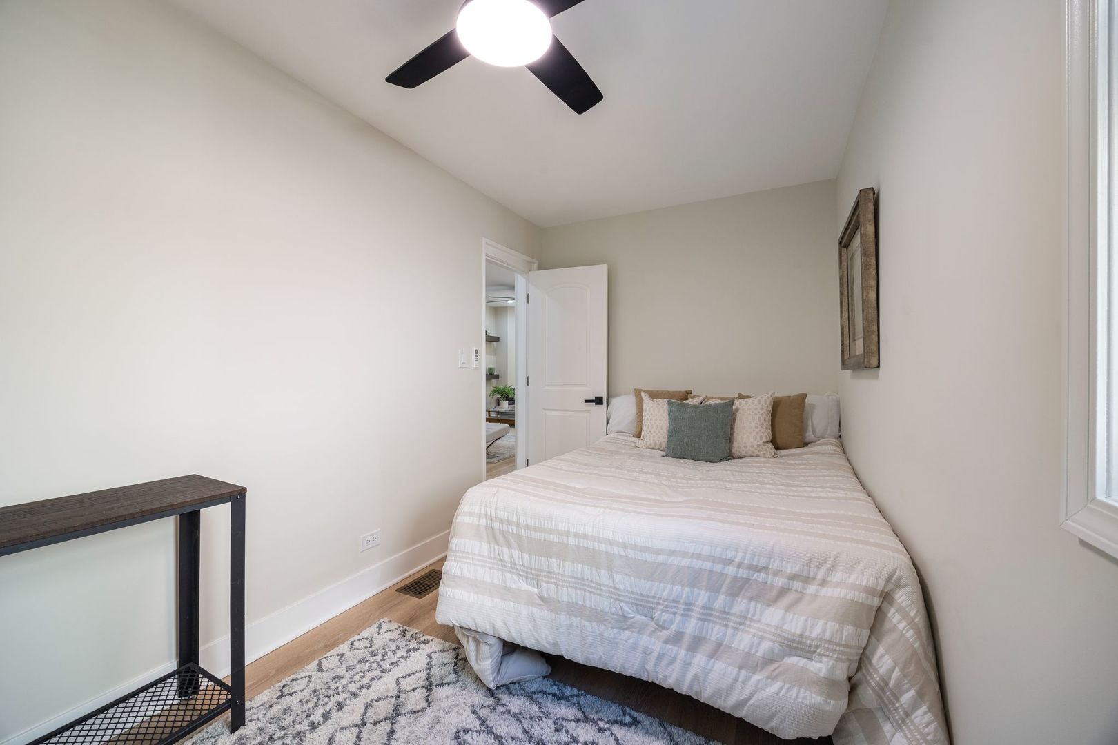 4143 North Drake Avenue Chicago, IL 60618 - Photo 18 of 40 a bedroom with a bed and a mirror