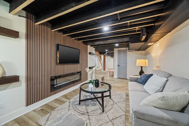 a view of room with wooden floor