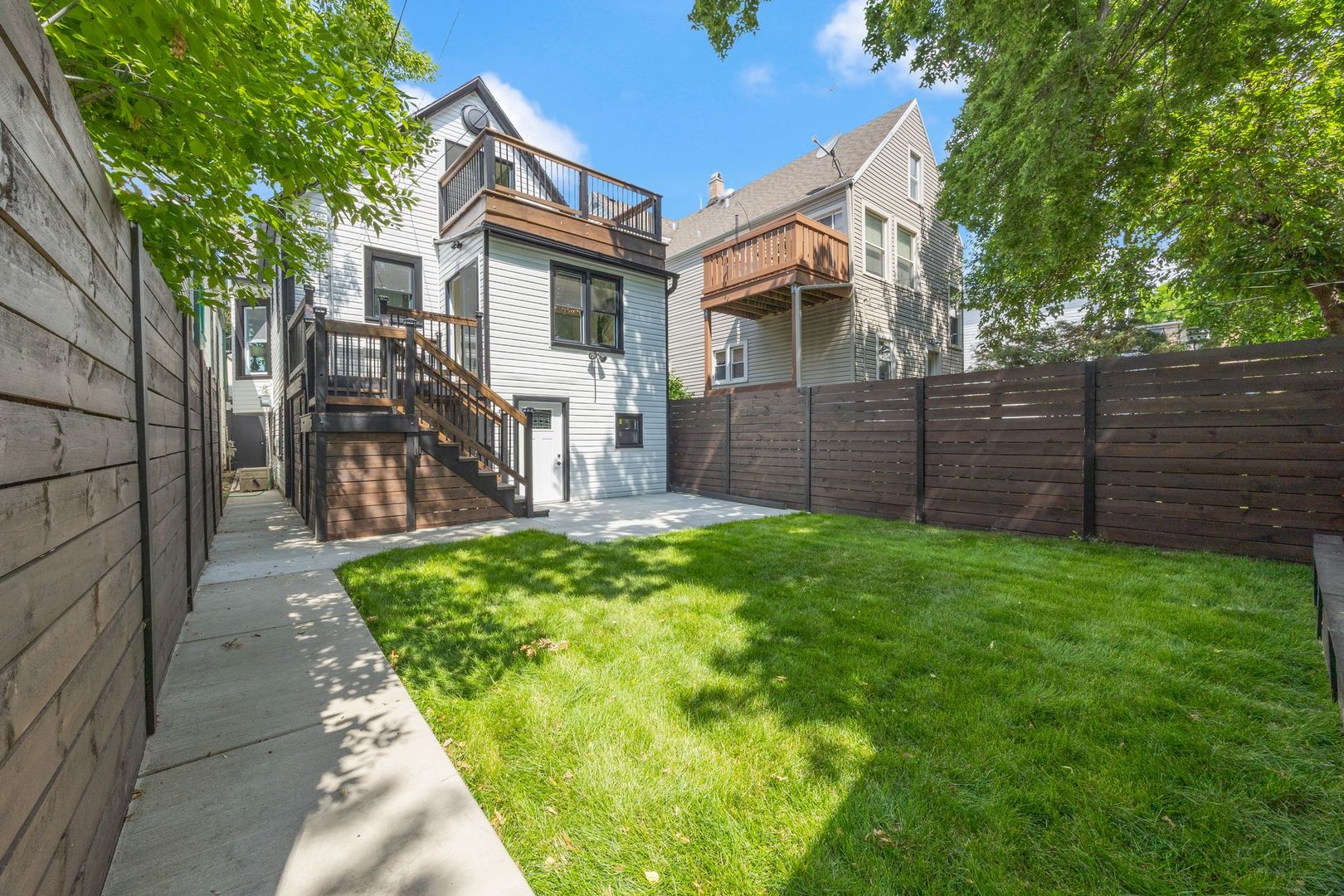4143 North Drake Avenue Chicago, IL 60618 - Photo 40 of 40 a view of backyard of house with green space