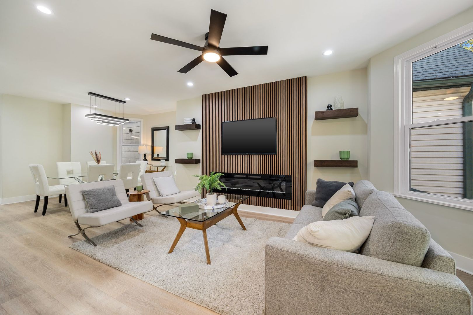 4143 North Drake Avenue Chicago, IL 60618 - Photo 4 of 40 a living room with furniture and a flat screen tv with wooden floor