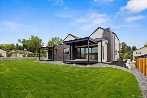 a view of a house with a yard porch and sitting area
