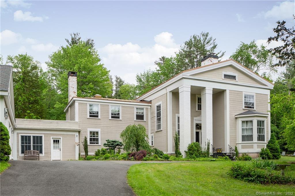 18 Cider Brook Road Avon, CT 06001 - Photo 1 of 1 a front view of a house with a yard and trees