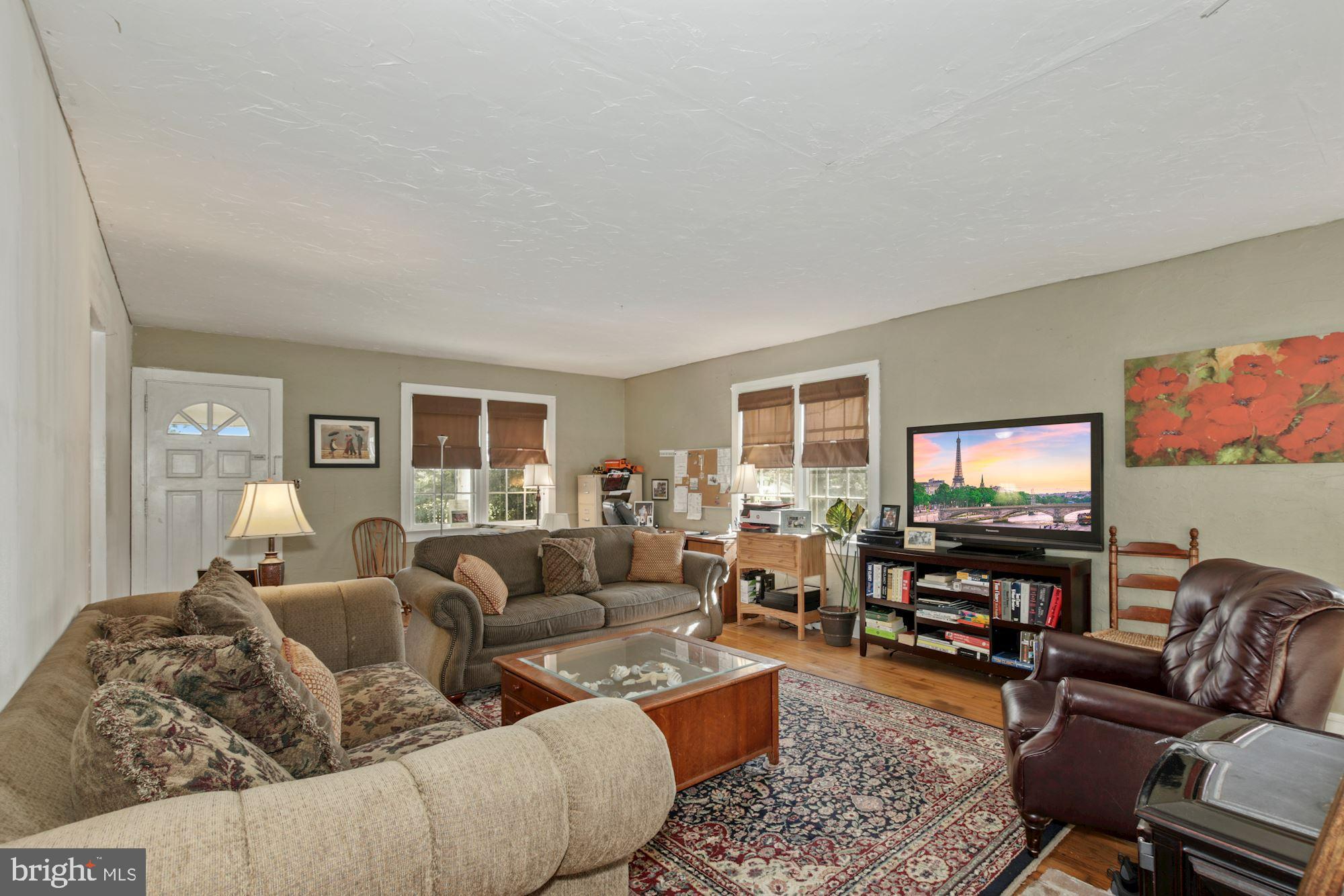 87 Eayrestown Road Medford, NJ 08055 - Photo 14 of 37 a living room with furniture and a flat screen tv