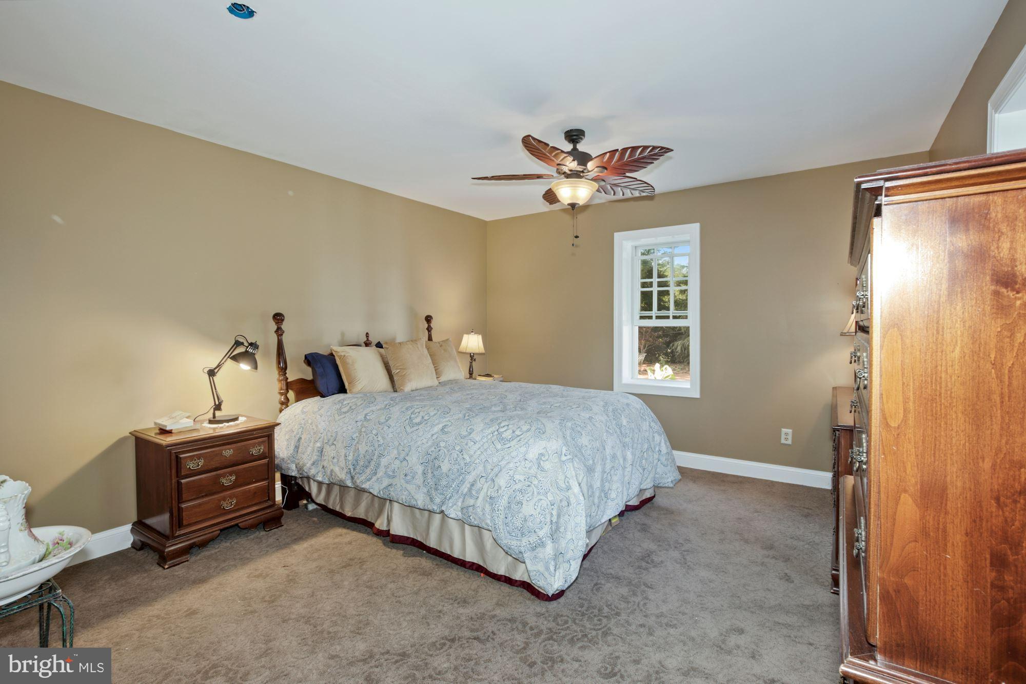 87 Eayrestown Road Medford, NJ 08055 - Photo 19 of 37 a bedroom with a bed dresser and a window
