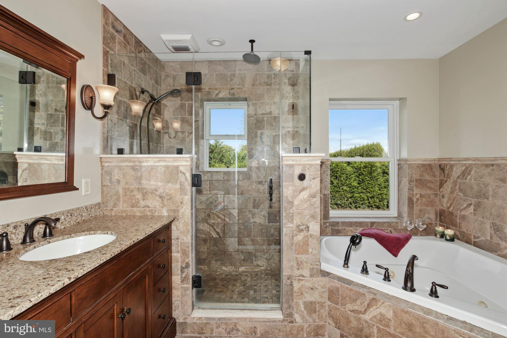 87 Eayrestown Road Medford, NJ 08055 - Photo 21 of 37 a bathroom with a granite countertop sink a mirror and shower