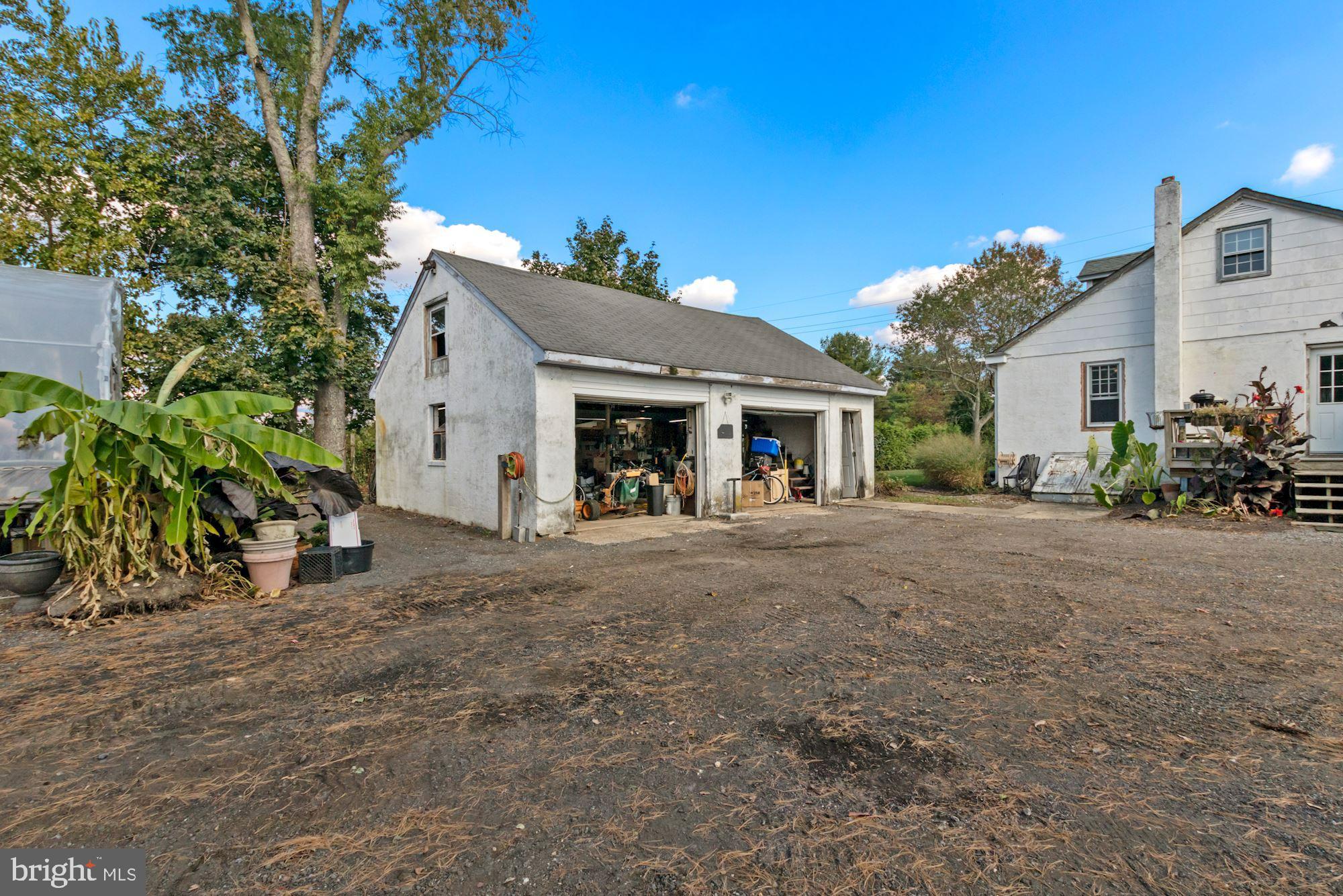87 Eayrestown Road Medford, NJ 08055 - Photo 29 of 37 a view of a house with a tree and plants