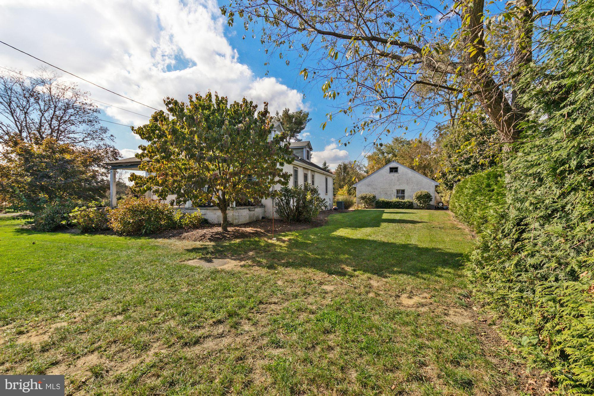 87 Eayrestown Road Medford, NJ 08055 - Photo 34 of 37 a view of a garden with plants and large trees