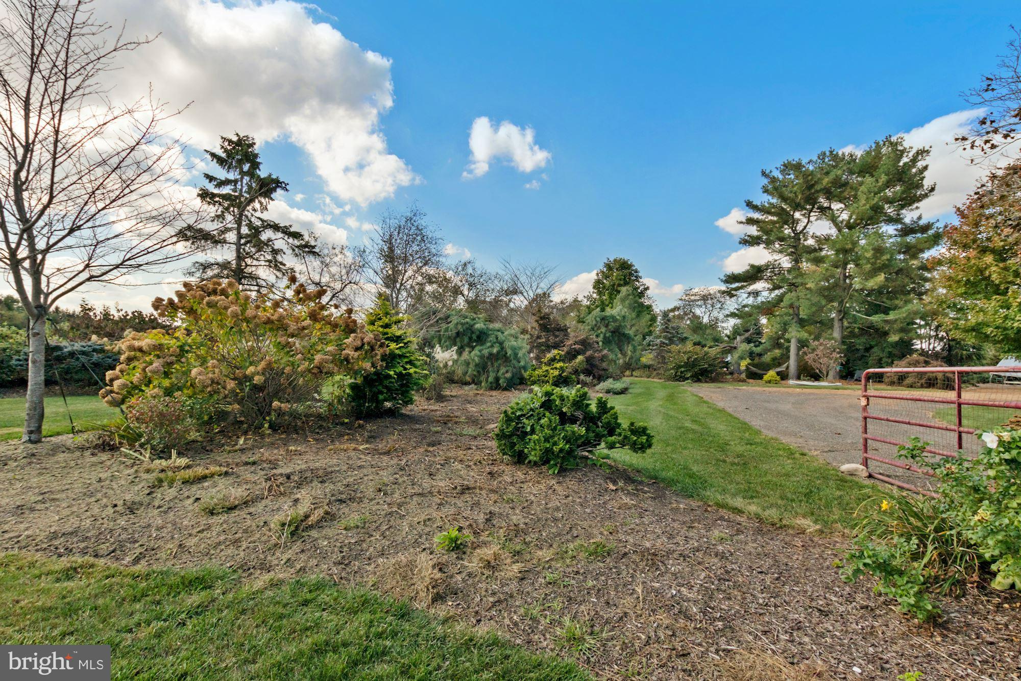 87 Eayrestown Road Medford, NJ 08055 - Photo 5 of 37 a view of a garden with large trees