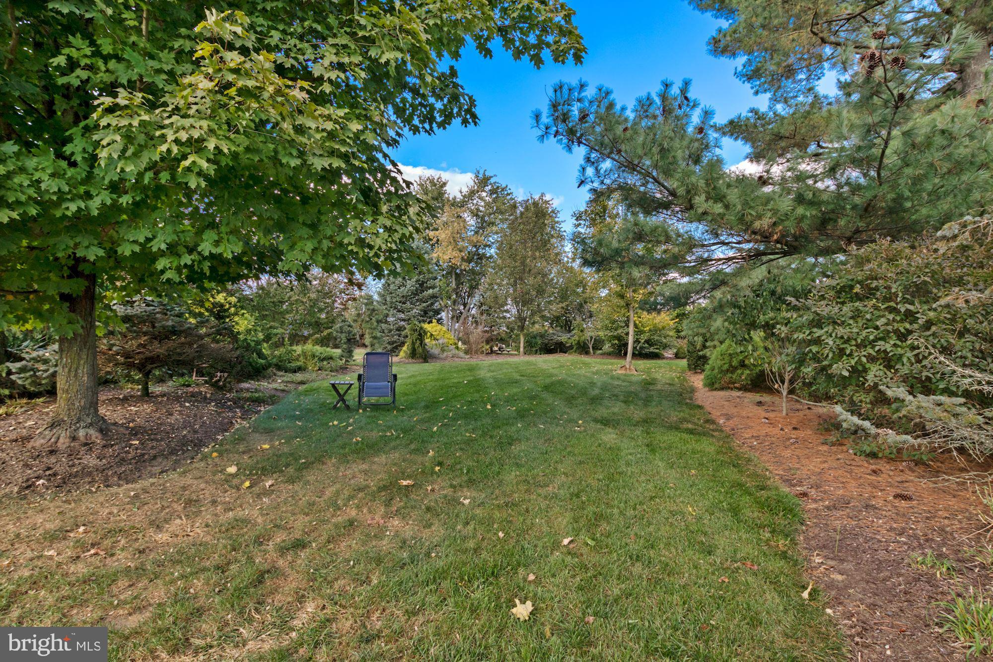87 Eayrestown Road Medford, NJ 08055 - Photo 7 of 37 a green field with lots of trees in it