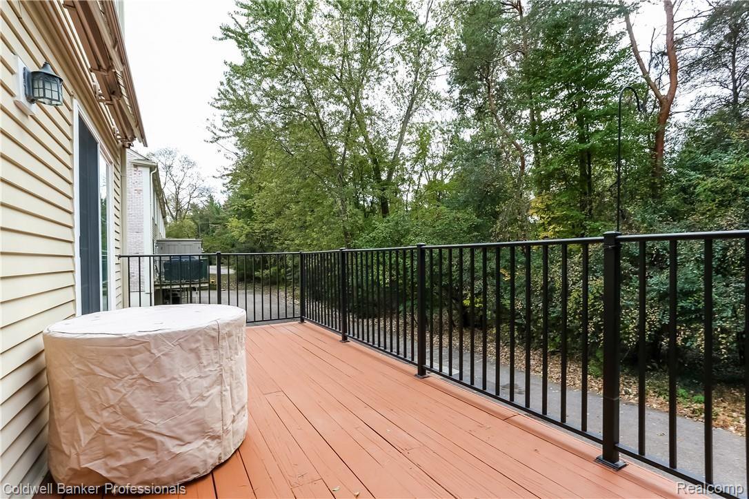 1483 Carriage Lane, Unit 17 Rochester, MI 48306 - Photo 22 of 28 Deck Overlooking Woods and Paint Creek Trail