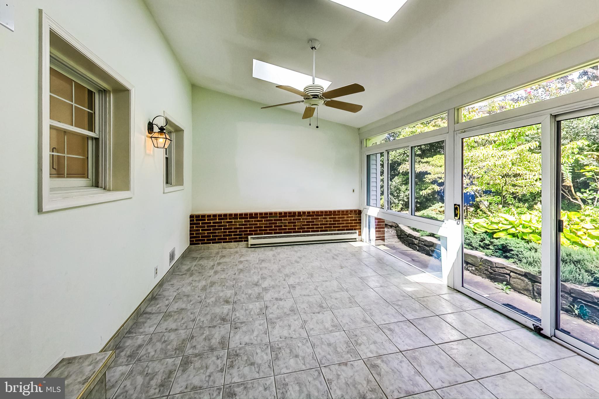 4513 Puller Drive Kensington, MD 20895 - Photo 18 of 46 a view of empty room with wooden floor and fan