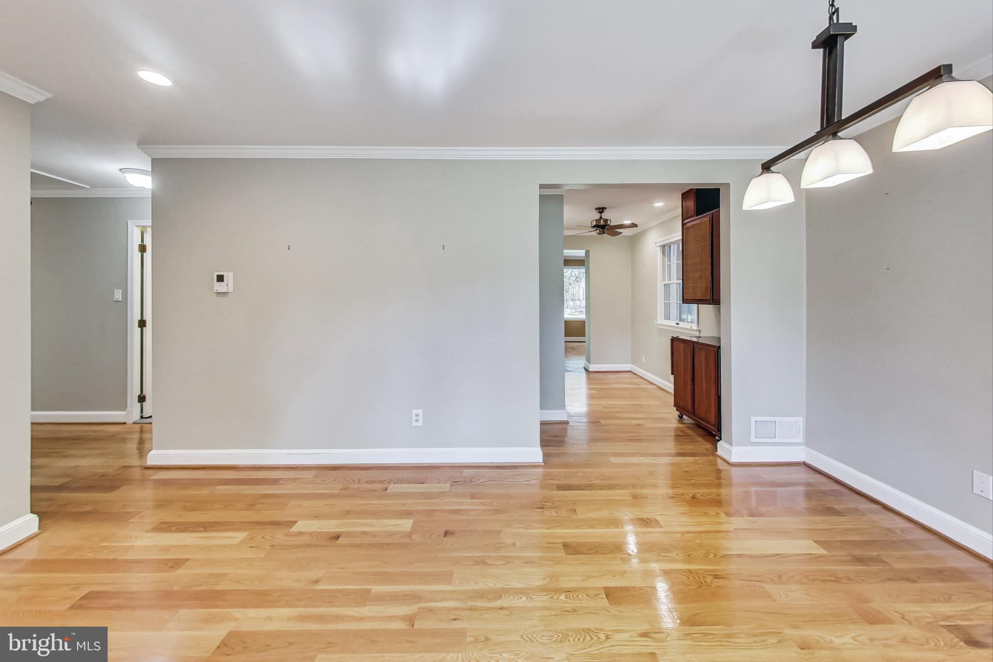 4513 Puller Drive Kensington, MD 20895 - Photo 2 of 46 a view of empty room with wooden floor