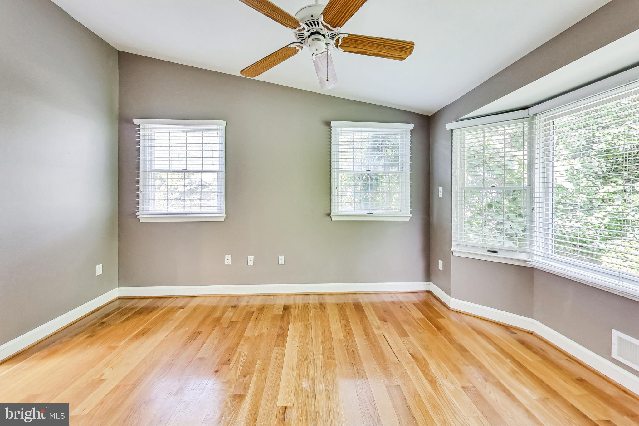 4513 Puller Drive Kensington, MD 20895 - Photo 22 of 46 a view of empty room with wooden floor and fan