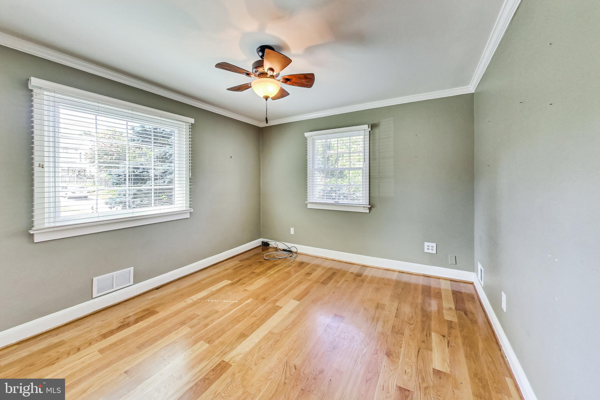 4513 Puller Drive Kensington, MD 20895 - Photo 27 of 46 a view of empty room with wooden floor and fan