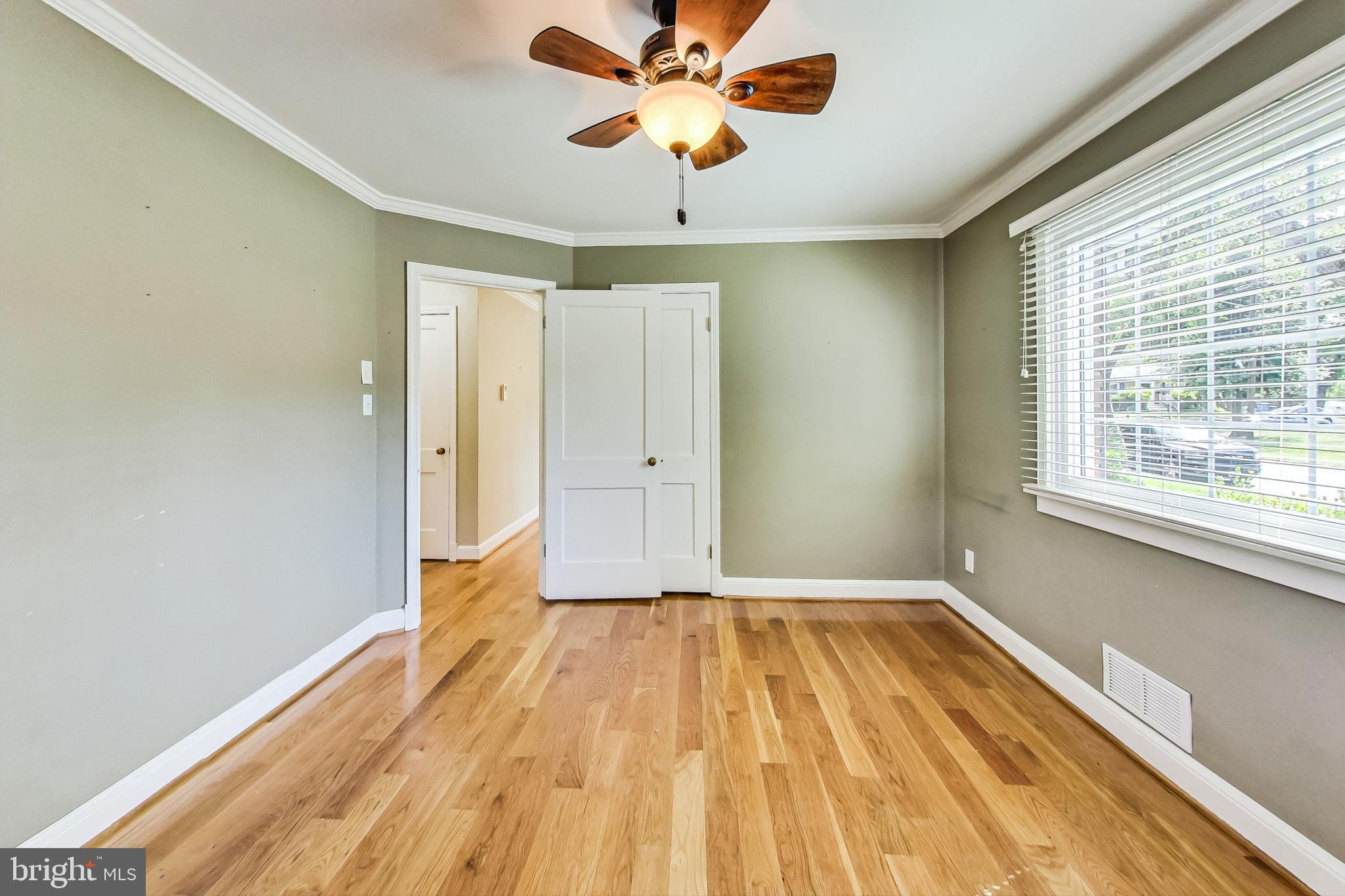 4513 Puller Drive Kensington, MD 20895 - Photo 28 of 46 a view of empty room with wooden floor and fan
