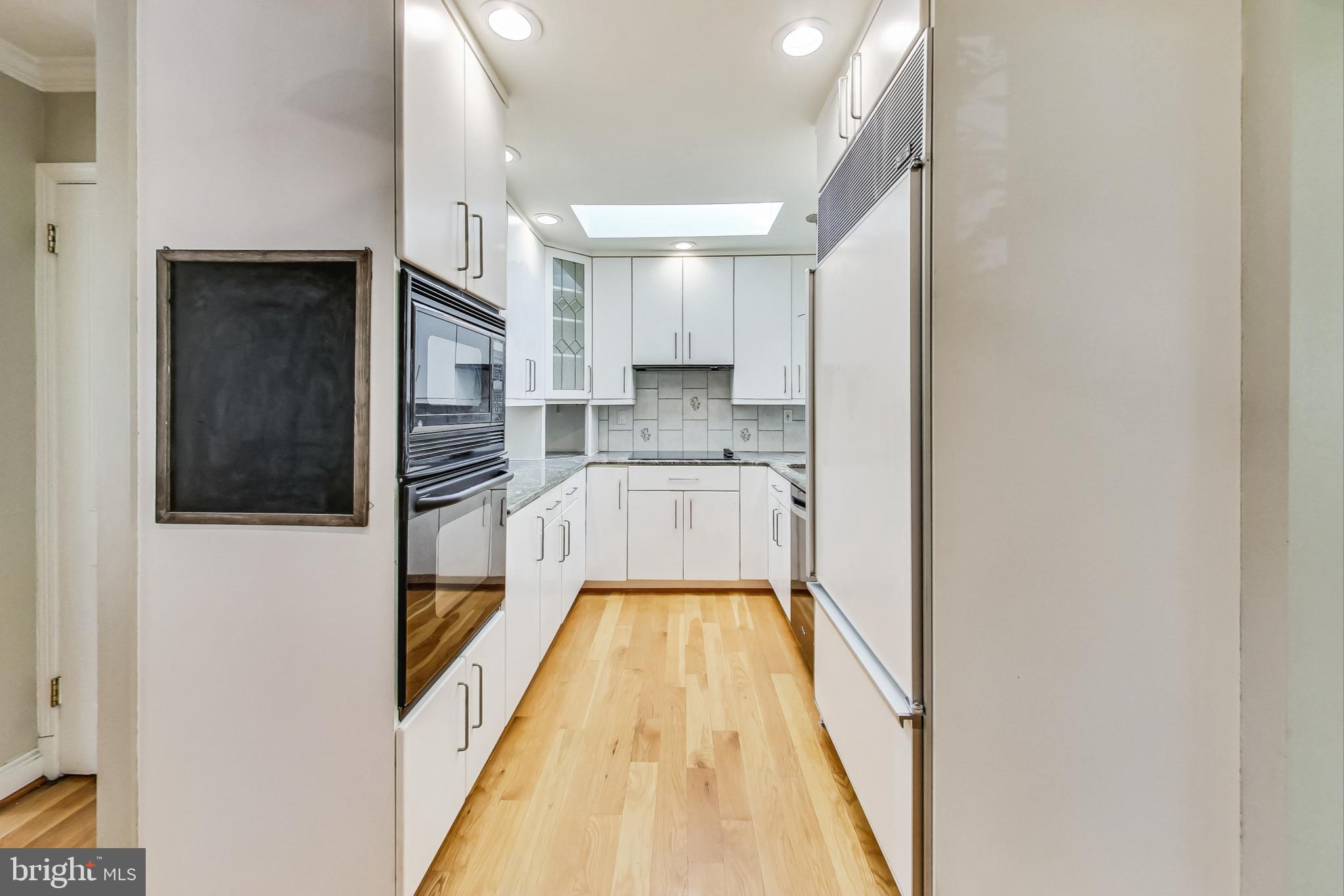 4513 Puller Drive Kensington, MD 20895 - Photo 8 of 46 a view of a kitchen from the hallway