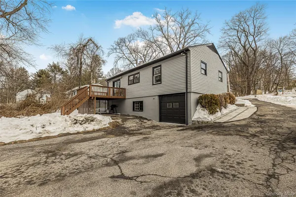 a view of a house with a snow in the yard