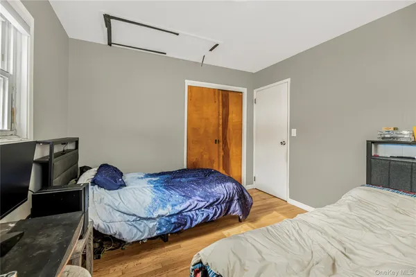 a bedroom with a bed and dresser