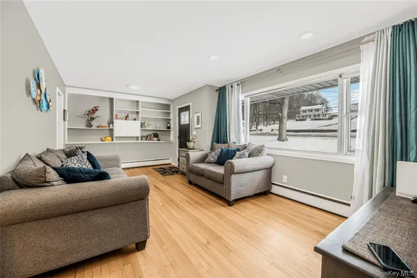 a living room with furniture and a window