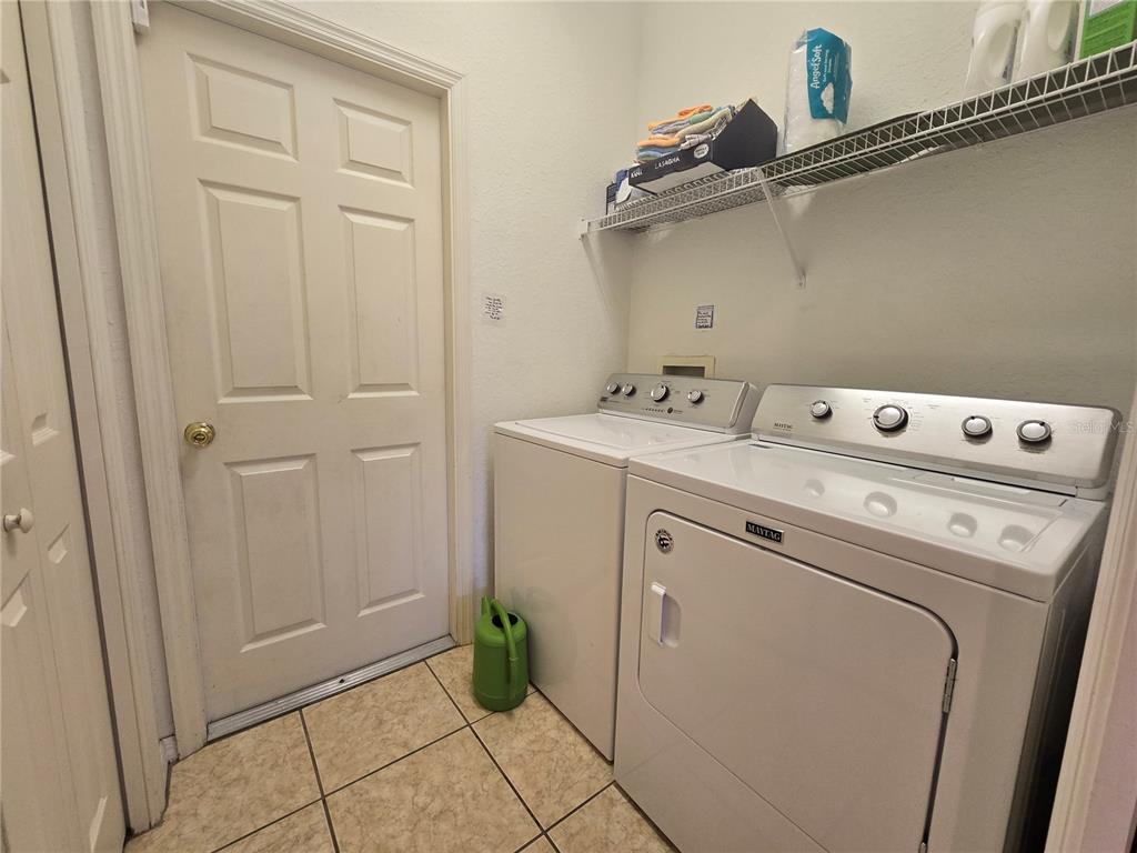 219 Cloverdale Road Winter Haven, FL 33884 - Photo 27 of 29 a utility room with dryer and washer