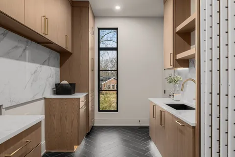 a view of a livingroom with wooden floor and a window
