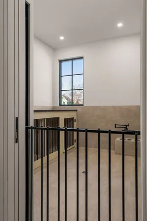 a kitchen with a table and chairs in it