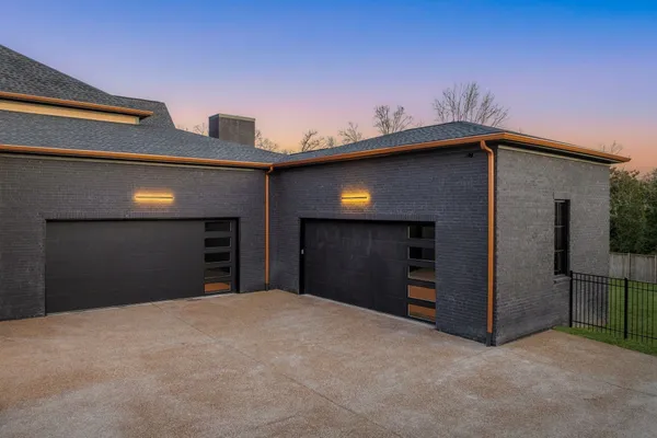a front view of a house with a garage