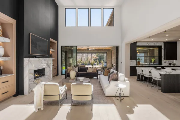 a kitchen with stainless steel appliances kitchen island granite countertop a stove a sink and a refrigerator