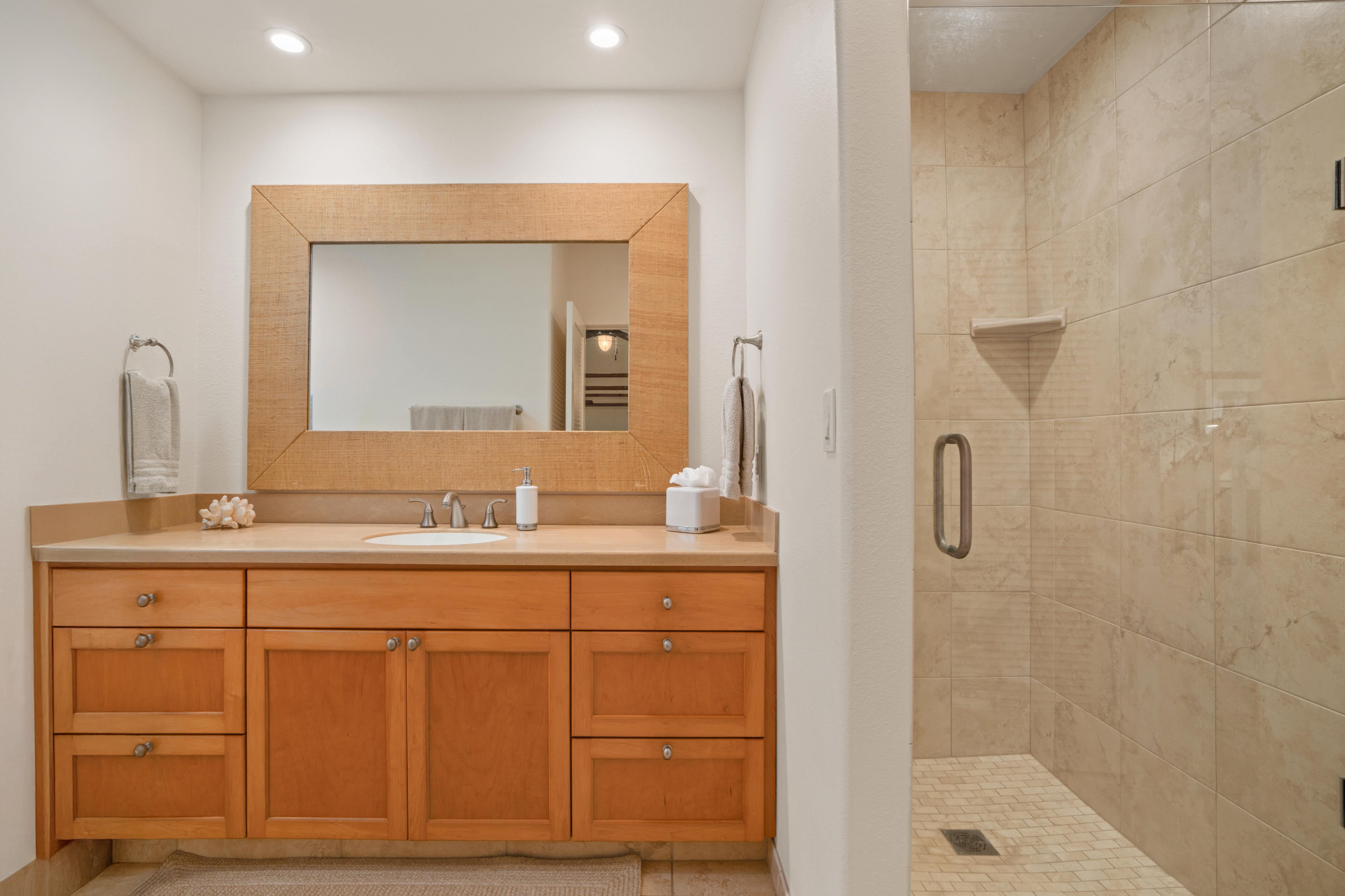 1565 Pe'e Road, Unit 125 Koloa, HI 96756 - Photo 12 of 20 a bathroom with a granite countertop sink a mirror and a