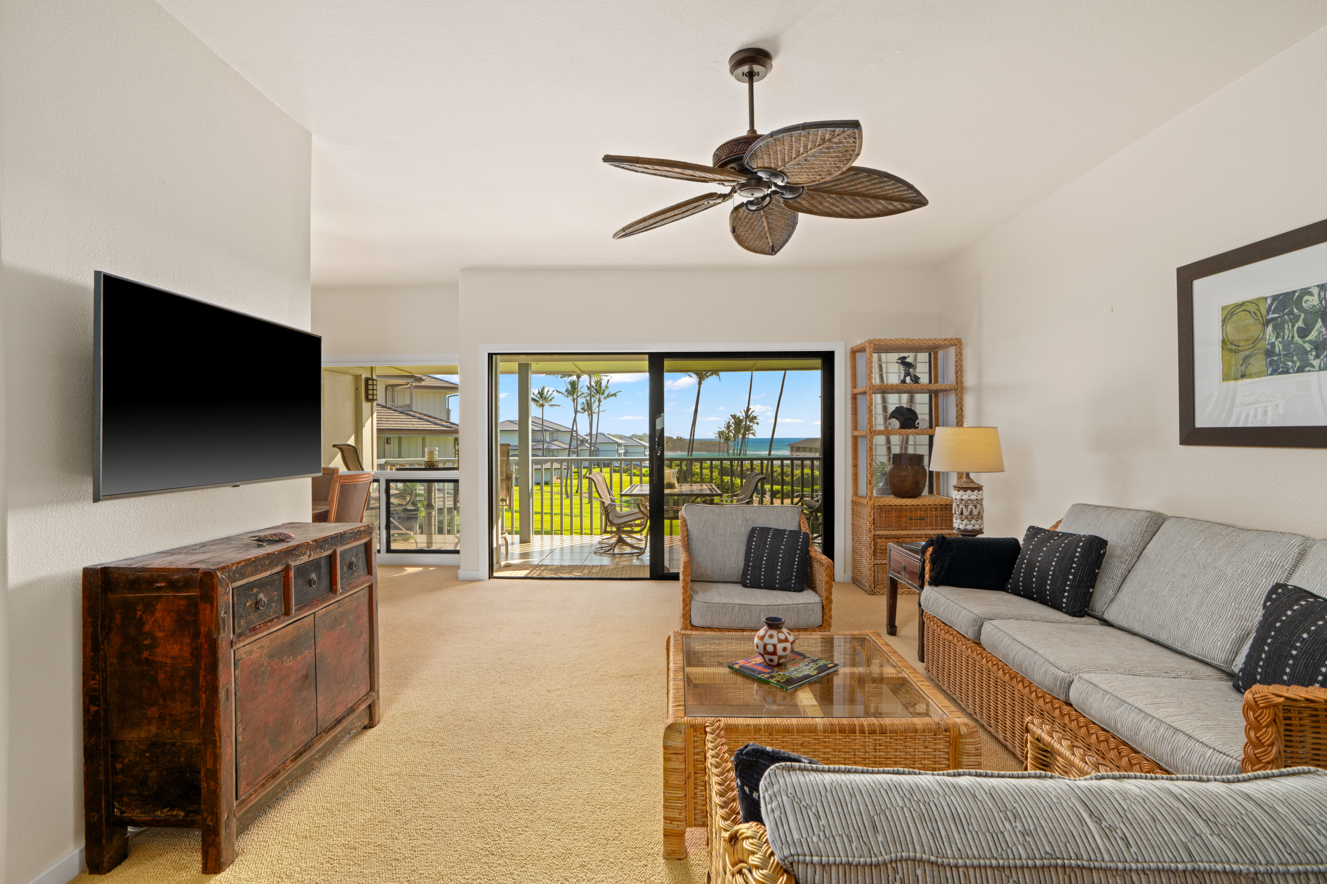 1565 Pe'e Road, Unit 125 Koloa, HI 96756 - Photo 3 of 20 a living room with furniture and a flat screen tv