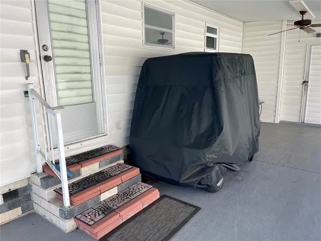 a living room with a bed and a window