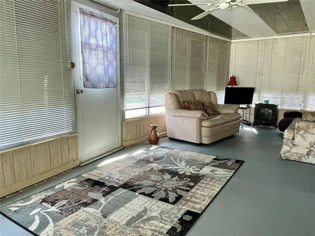 a living room with furniture and a rug