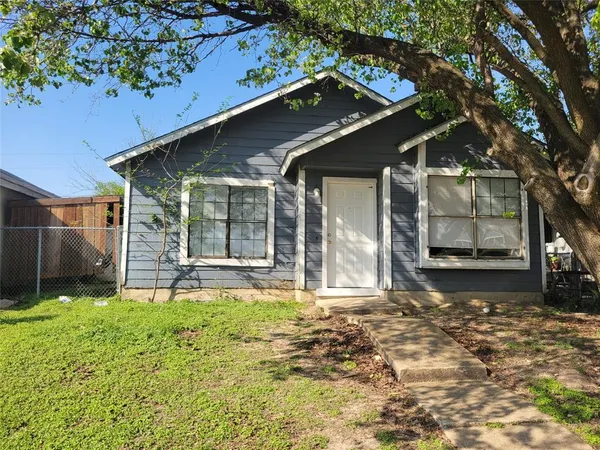 a house with trees in the background