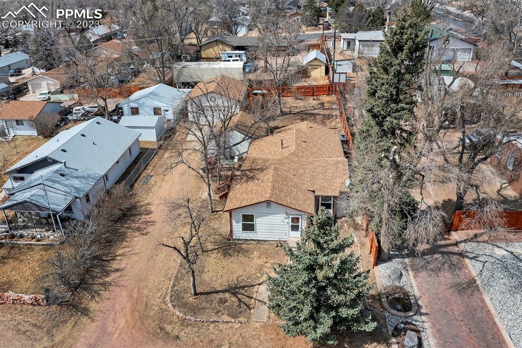 1128 Alexander Road Colorado Springs, CO 80909 - Photo 25 of 26 an aerial view of residential houses with outdoor space