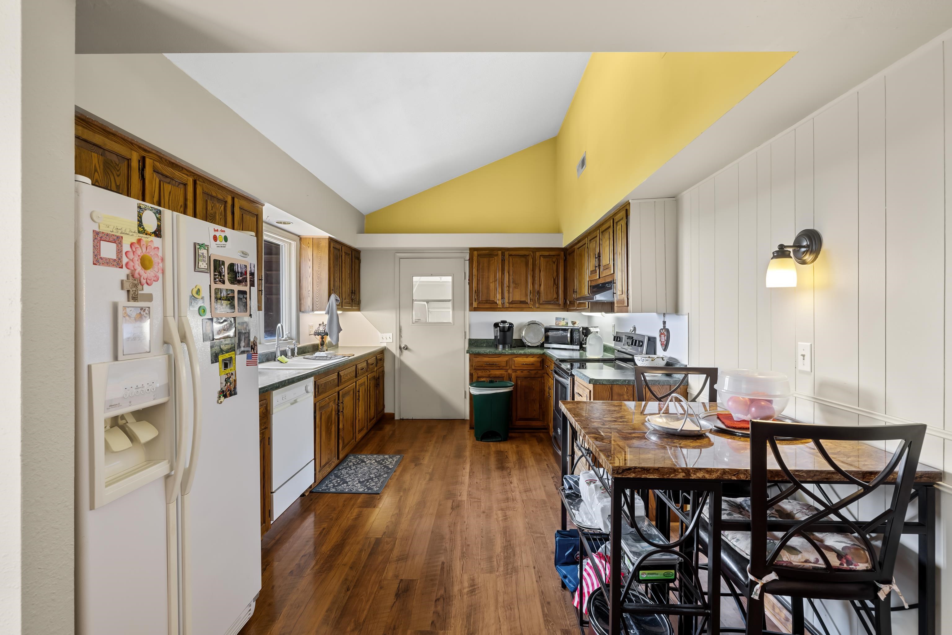 2059 Old Greenville Road Staunton, VA 24401 - Photo 19 of 60 a kitchen with a table chairs refrigerator and microwave
