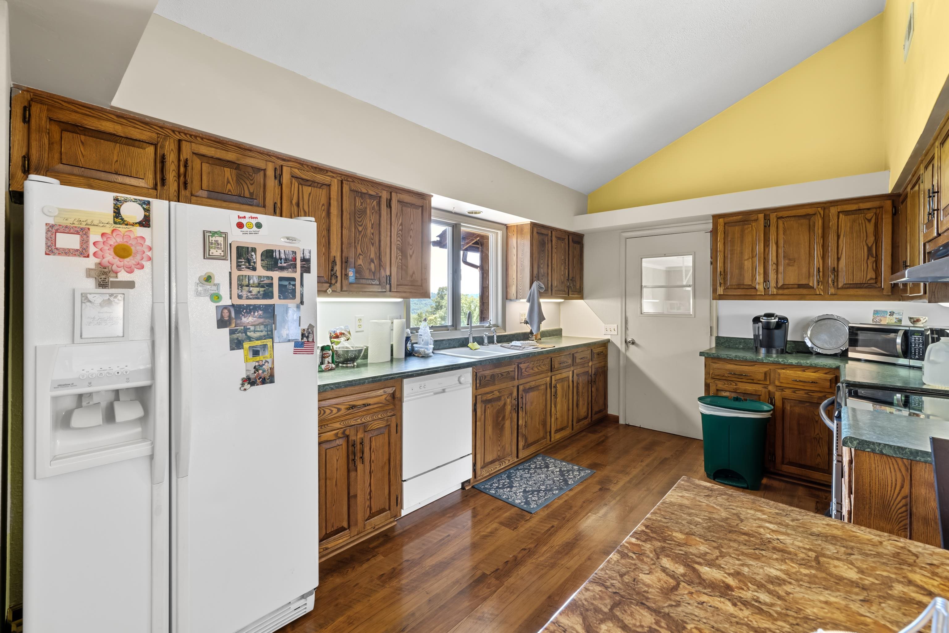2059 Old Greenville Road Staunton, VA 24401 - Photo 20 of 60 a kitchen with stainless steel appliances granite countertop a refrigerator sink and stove