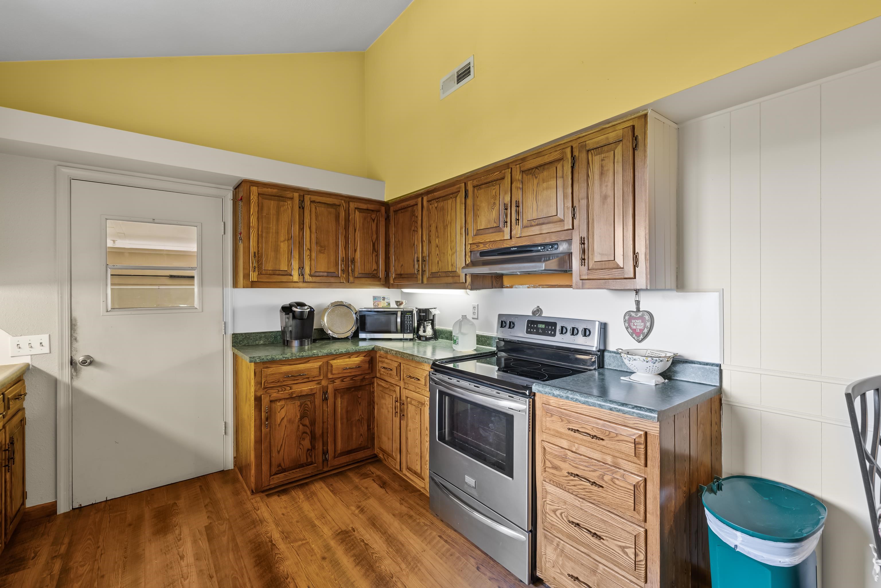 2059 Old Greenville Road Staunton, VA 24401 - Photo 21 of 60 a kitchen with a sink stove and cabinets