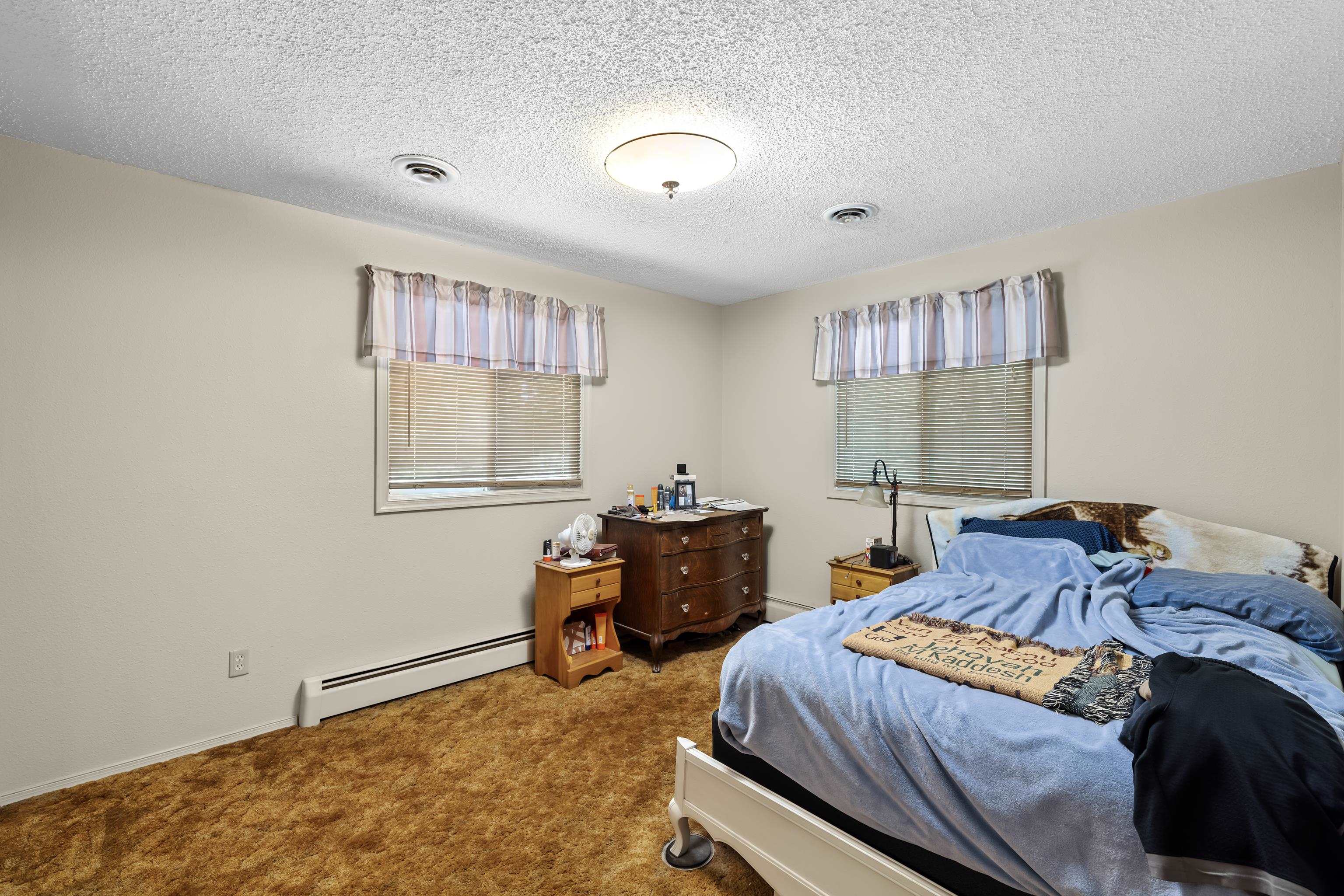 2059 Old Greenville Road Staunton, VA 24401 - Photo 29 of 60 a bedroom with a bed and a table in it