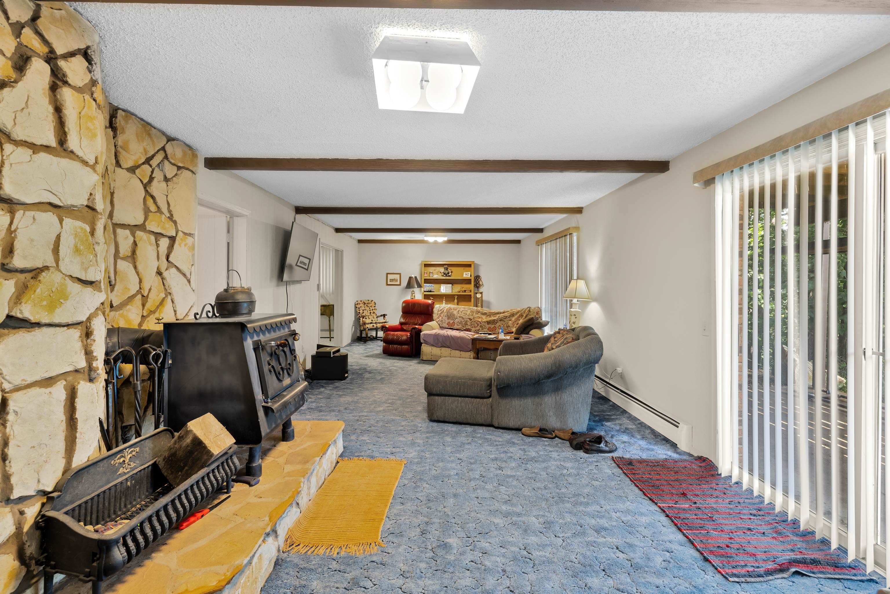 2059 Old Greenville Road Staunton, VA 24401 - Photo 35 of 60 a living room with furniture a fireplace and a window