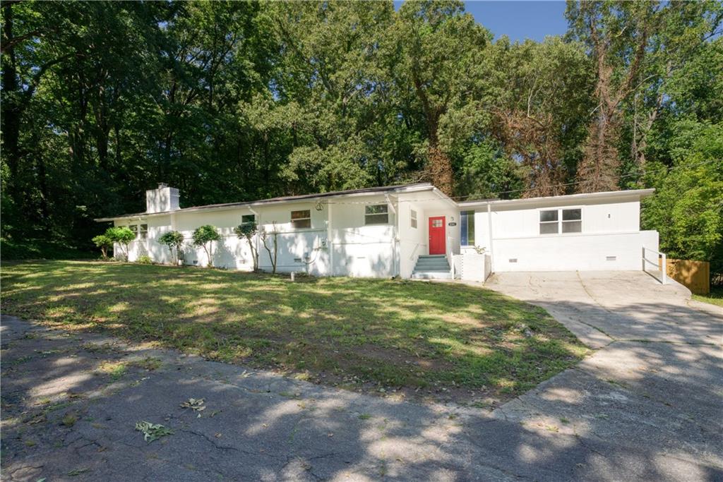 2351 Columbia Drive Decatur, GA 30032 - Photo 1 of 1 a view of a white house with a yard