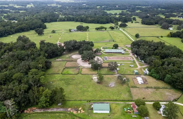 an aerial view of a residential houses and outdoor space