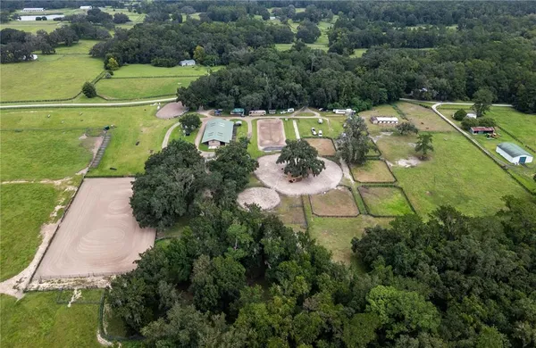an aerial view of a house with outdoor space
