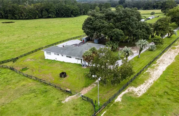 a view of a swimming pool with a yard