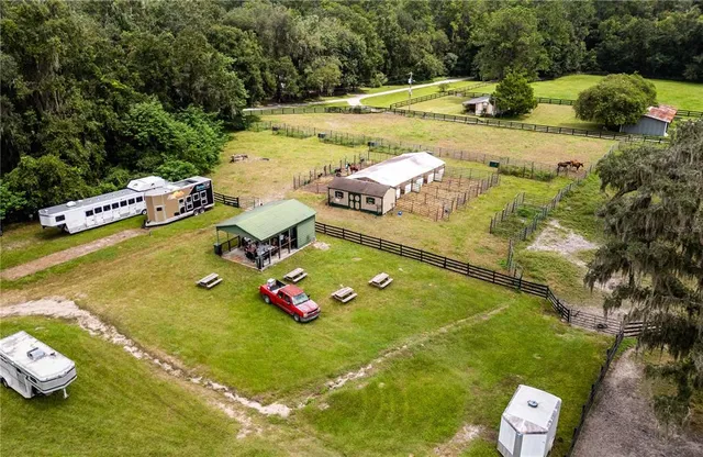 a view of a swimming pool with a outdoor seating